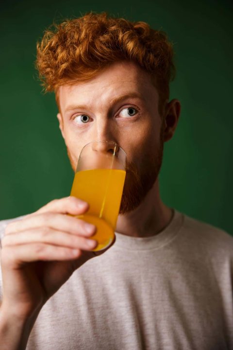 Healthy man taking probiotics for his gastrointestinal health