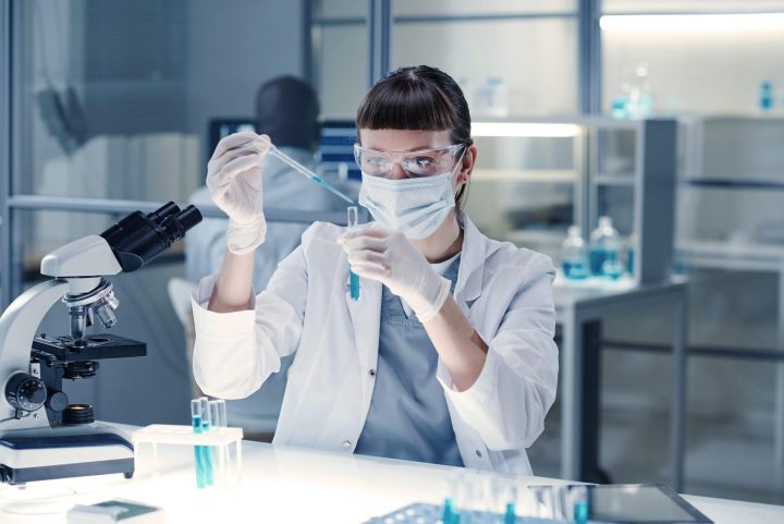 Woman in a lab analyzing distinct strains