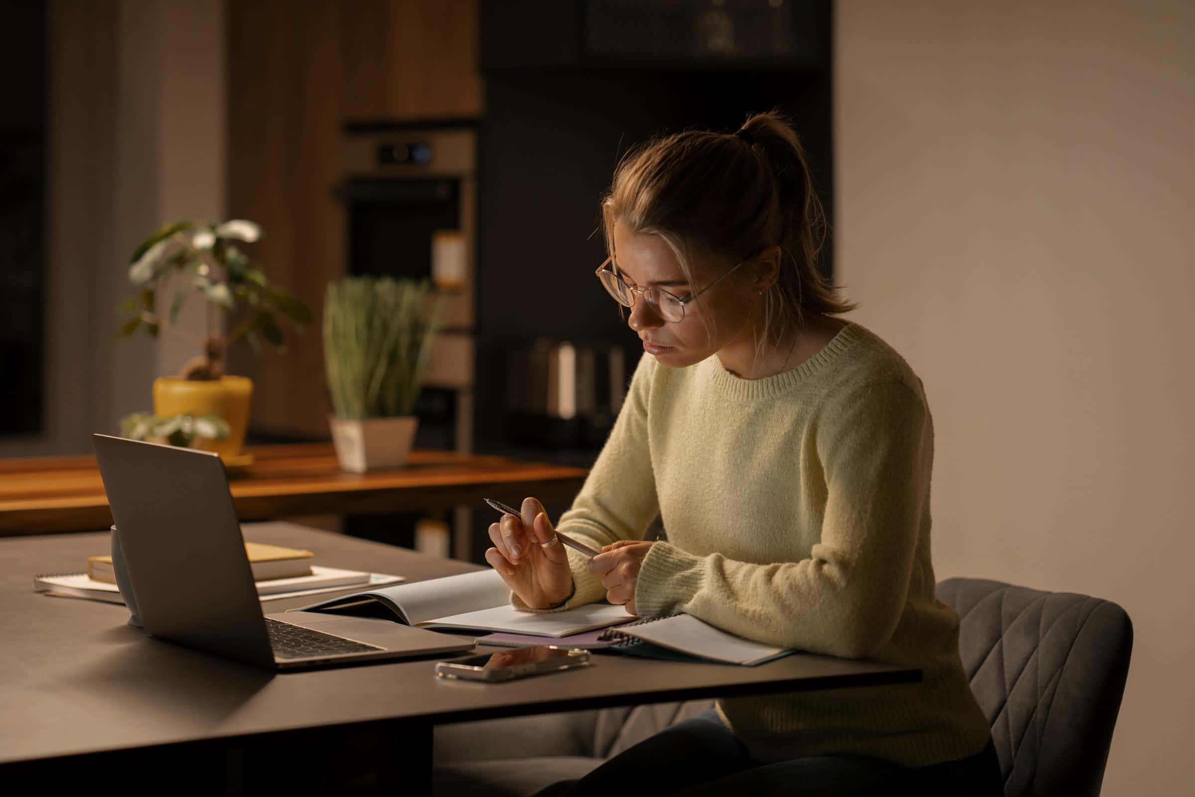 Woman working and studying with cognitive health support from AB-BIOTICS