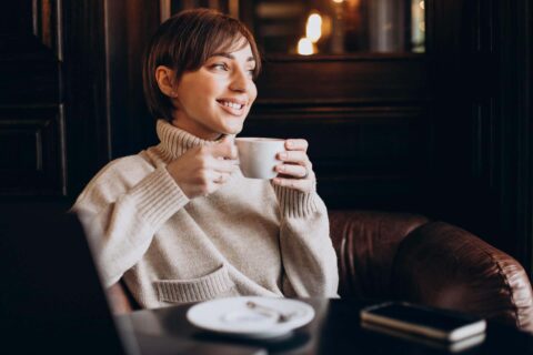 Healthy woman enjoying a coffee