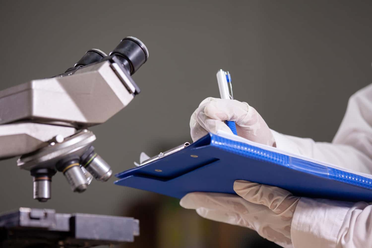 Scientists with a microscope